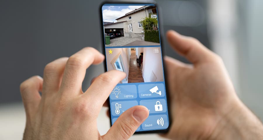 Homeowner looking at video camera streams on a smartphone